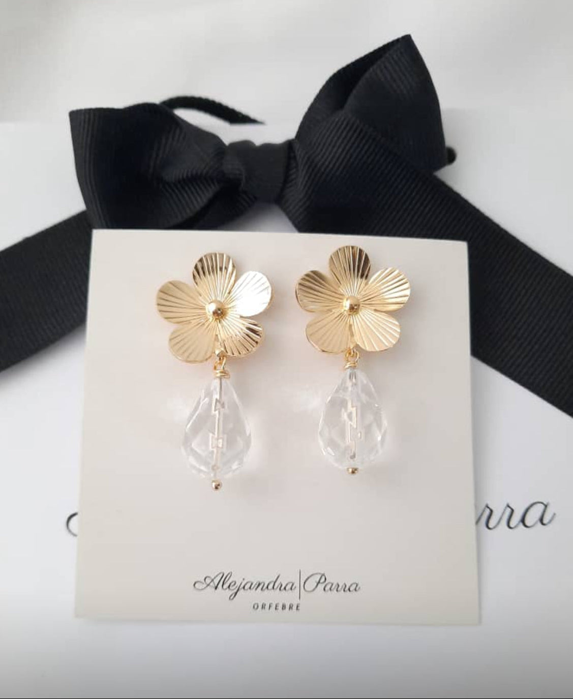 Gold plated flower crystal dangle earrings from Alejandra Parra Collection.