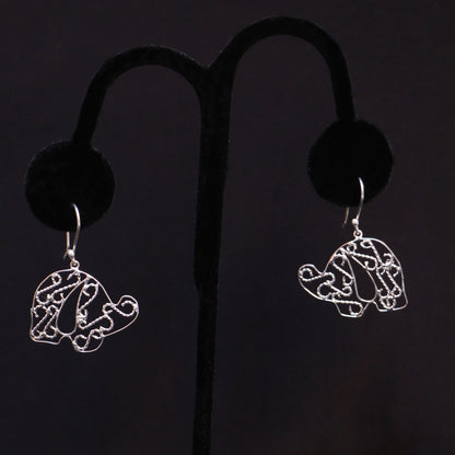 Sterling silver elephant earrings on a black handmade artisan jewelry Mexico.