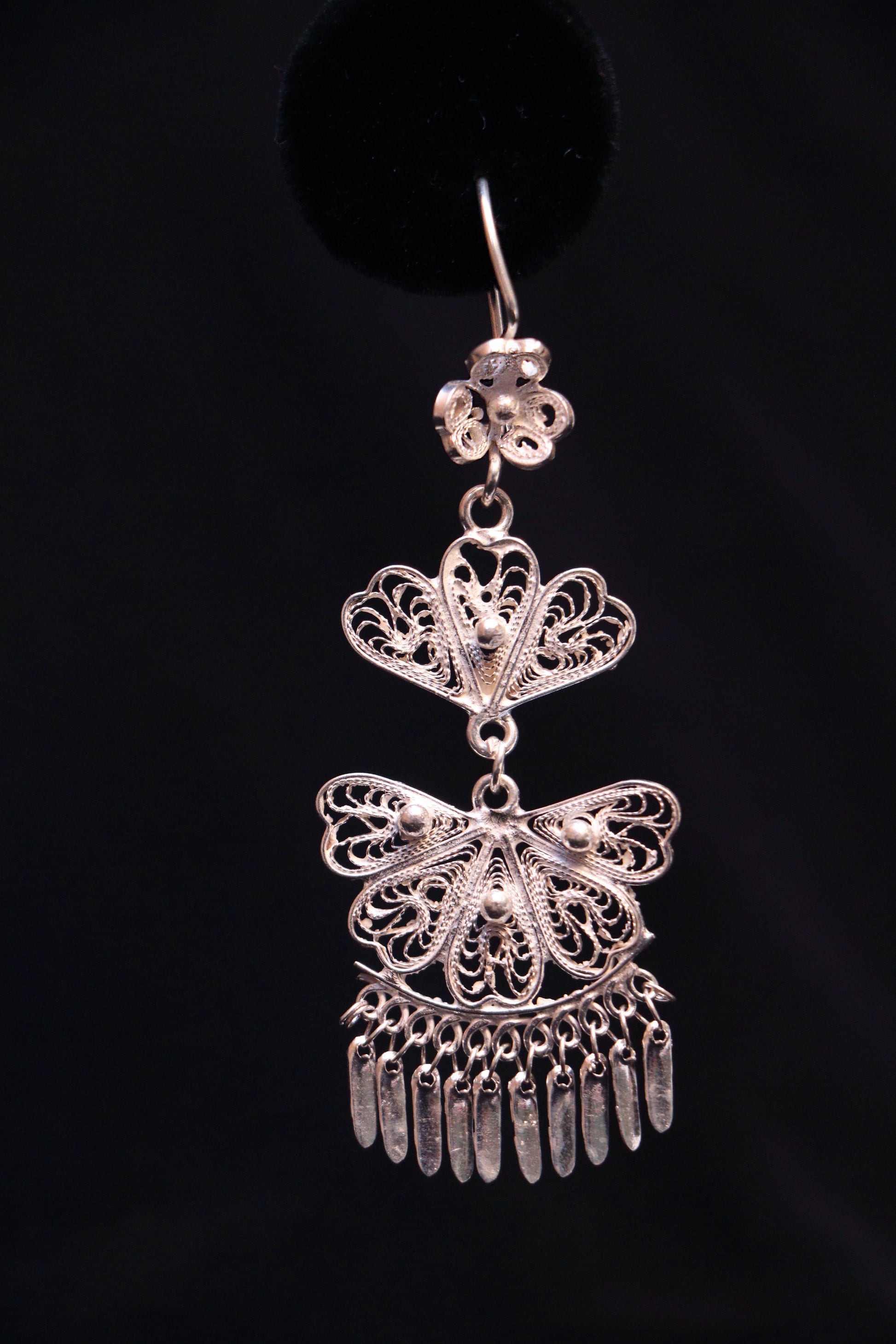Handmade sterling silver chandelier earrings featuring intricate Mexican filigree scrollwork.