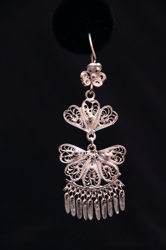 Handmade sterling silver chandelier earrings featuring intricate Mexican filigree scrollwork.