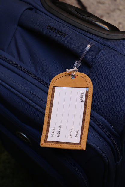 Handwoven luggage tag handmade from traditional Huipil textiles in Guatemala with a sturdy plastic latch that secures your luggage and includes and information card to keep your belongings identifiable.