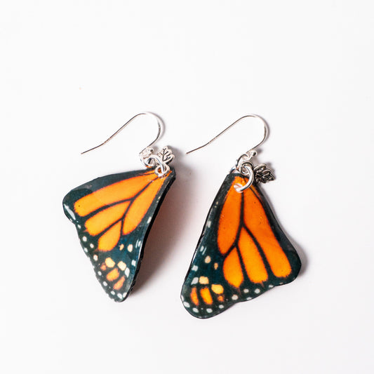 hand painted resin monarch butterfly wing earrings with sterling silver ear wires.